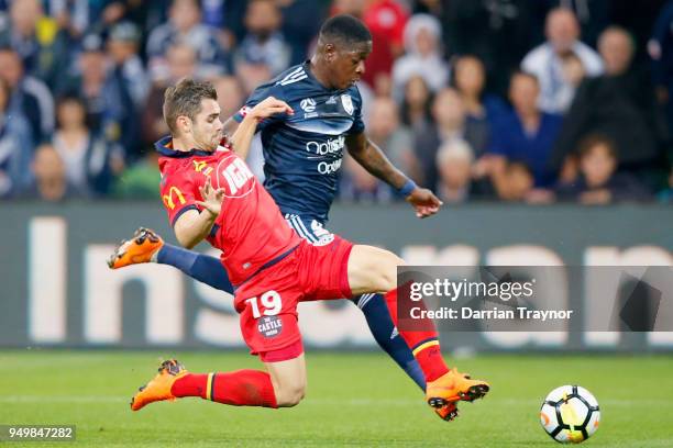 Ben Garuccio of Adelaide United tackles Leroy George of the Victory during the A-League Elimination Final match between Melbourne Victory and...