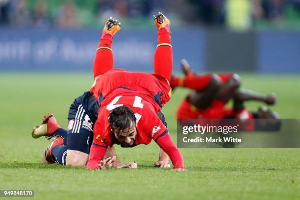 Nikola Mileisnic of Adelaide United climbs over Leigh Broxham during the A-League Elimination Final match between Melbourne Victory and Adelaide...