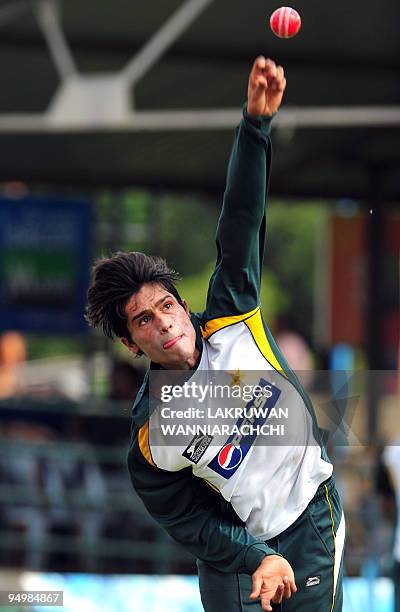 Pakistani cricketer Mohammad Aamer delivers a ball during a practice session at the P. Saravanamuttu Stadium in Colombo on July 11, 2009. Sri Lanka...