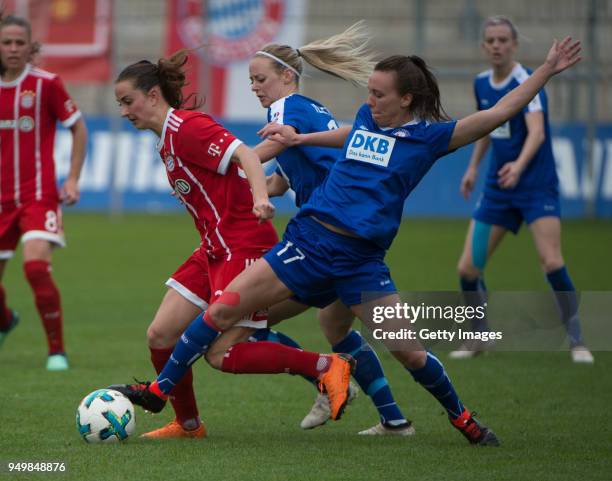Sara Daebritz of Munich challenges Amanda Ilestedt and Viktoria Schwalm of Potsdam during the Women's DFB Cup Semi Final match between Bayern...
