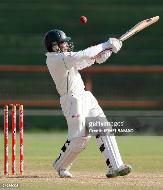 Bangladeshi cricketer Mushfiqur Rahim plays a shot off West Indies bowler Tino Best during the fourth day of the first Test match between West Indies...
