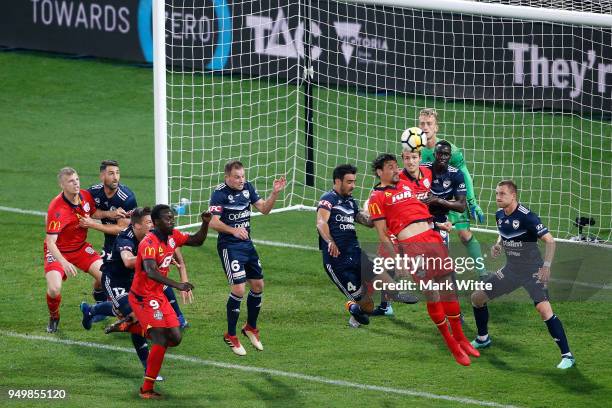 Ersan Gülüm of Adelaide United heads the ball in front of goals during the A-League Elimination Final match between Melbourne Victory and Adelaide...