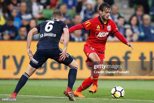 Nikola Mileusnic of Adelaide United runs with the ball during the A-League Elimination Final match between Melbourne Victory and Adelaide United at...