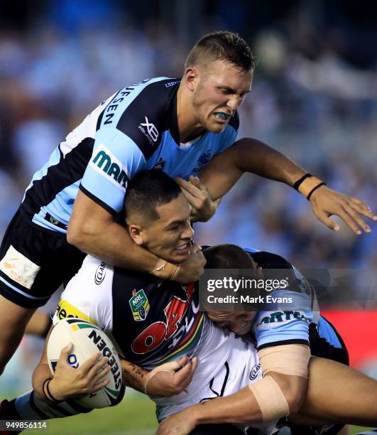 Dallin Watene-Zelezniak of the Panthers is tackled by the Sharks defence during the round seven NRL match between the Cronulla Sharks and the Penrith...