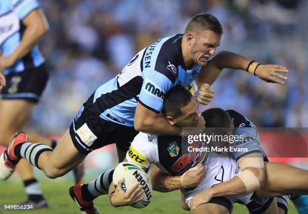 Dallin Watene-Zelezniak of the Panthers is tackled by the Sharks defence during the round seven NRL match between the Cronulla Sharks and the Penrith...