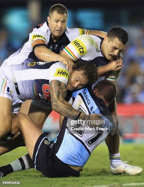 Kurt Dillon of the Sharks is tackled by the Panthers defence during the round seven NRL match between the Cronulla Sharks and the Penrith Panthers at...