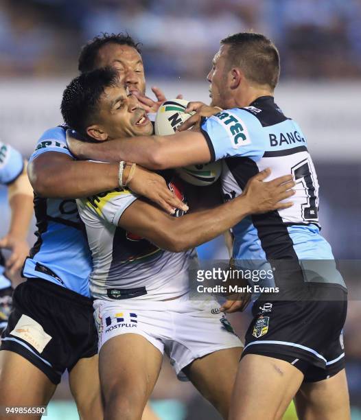Tyrone Peachey of the Panthers is tackled by the Sharks defence during the round seven NRL match between the Cronulla Sharks and the Penrith Panthers...