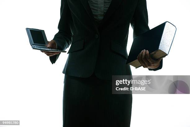 woman holding a different kind of dictionary - kind computer stock pictures, royalty-free photos & images