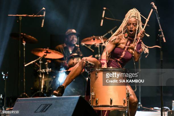 Ivorian dancer and singer Dobet "Valerie" Gnahore performs on April 22, 2018 in Marcory district of Abidjan during the Anoumabo Urban music Festival .