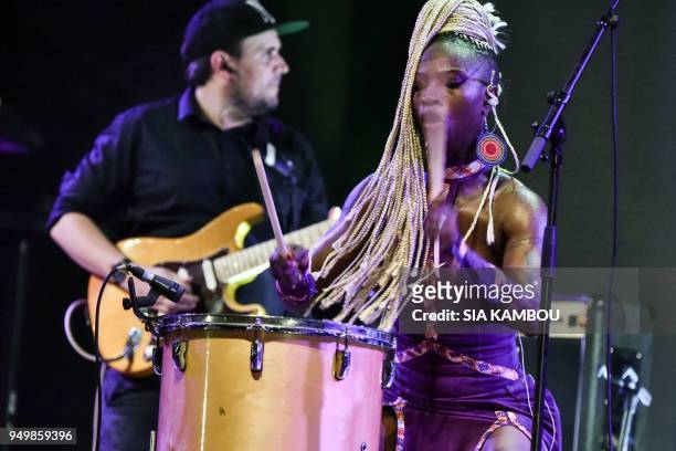 Ivorian dancer and singer Dobet "Valerie" Gnahore performs on April 22, 2018 in Marcory district of Abidjan during the Anoumabo Urban music Festival .