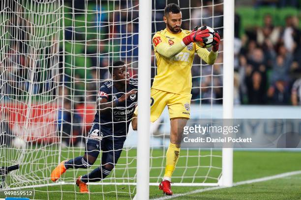 Adelaide United goalkeeper Paul Izzo holds the ball after Leroy George of the Victory scored a goal during the A-League Elimination Final match...