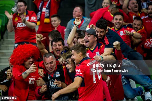 Nikola Mileusnic of Adelaide United celebrates with Nathan Konstandopoulos of Adelaide United and Adelaide United supporters after scoring a goal...