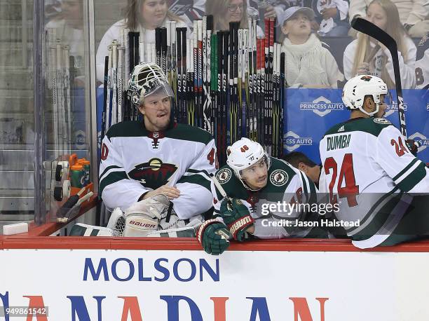 Devan Dubnyk of the Minnesota Wild sits on the bench after being pulled in Game Five of the Western Conference First Round during the 2018 NHL...