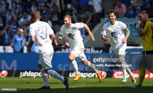 Nico Hammann of 1. FC Magdeburg celebrates after scoring his team's second goal next to Richard Weil and Christian Beck of 1. FC Magdeburg during the...