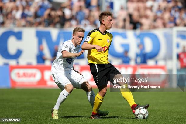 Nils Butzen of 1. FC Magdeburg and Nico Brandenburger of Fortuna Koeln compete during the 3. Liga match between 1. FC Magdeburg and SC Fortuna Koeln...