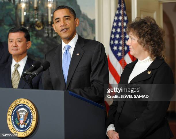 President Barack Obama speaks on making government more efficient and effective as SAVE Award winner Nancy Fichtner of Colorado and Secretary of...