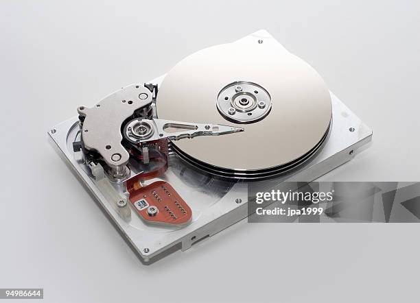 photography of the inside of a hard drive - hard drive stockfoto's en -beelden