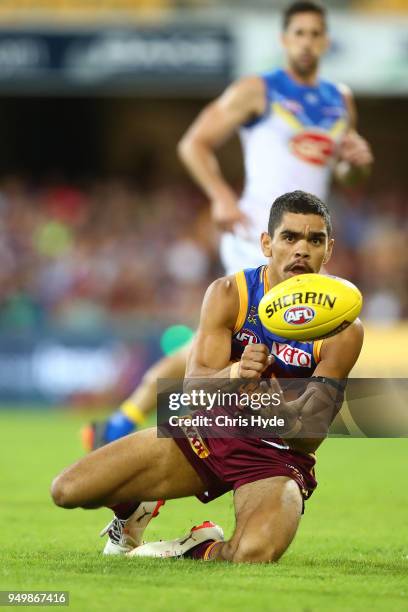 Charlie Cameron of the Lions handballs during the round five AFL match between the Brisbane Lions and the Gold Coast Suns at The Gabba on April 22,...