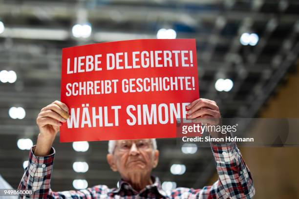 Guest holds up a poster with a slogan to vote for Simone Lange during the SPD federal party congress on April 22, 2018 in Wiesbaden, Germany....