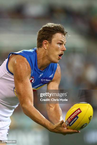 Nick Holman of the Suns handballs during the round five AFL match between the Brisbane Lions and the Gold Coast Suns at The Gabba on April 22, 2018...