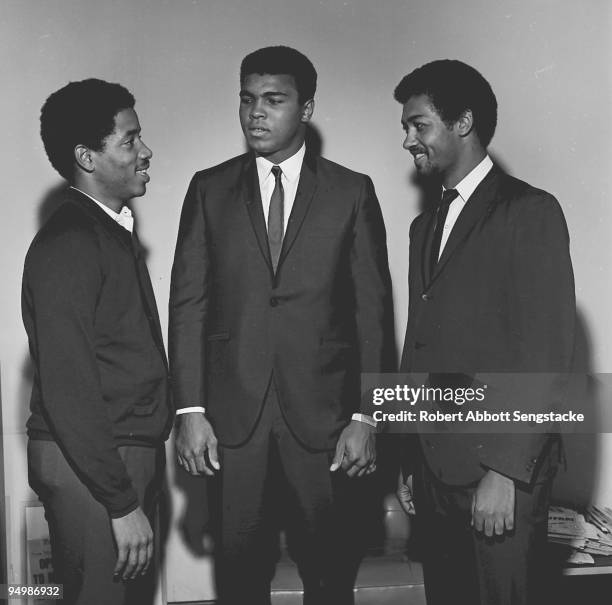 The boxer Muhammad Ali stands with two unidentified friends, Chicago, IL, 1965.