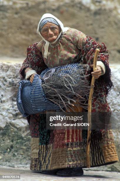 Aups. Mamie Martin , santon maker. Best artist worker of France. The old woman with a fagot, Provence, France.