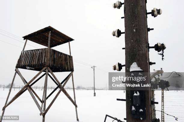 Guard tower and part of the life barbed wire encloses the Auschwitz II-Birkenau extermination camp on December 17, 2009 in Brzezinka, Poland....