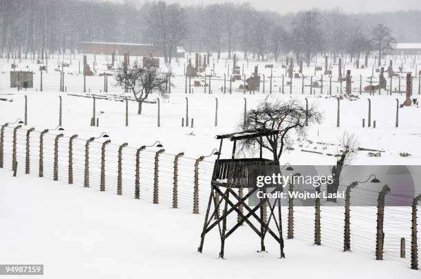 Guard tower, life barbed wire and wrecked chimneys of the former Auschwitz II-Birkenau extermination camp on December 17, 2009 in Brzezinka, Poland....