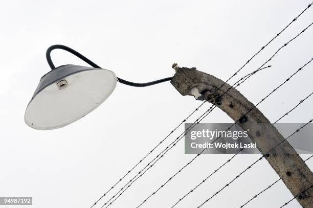 Lamp on a barbed wire encloses the Auschwitz II-Birkenau extermination camp on December 17, 2009 in Brzezinka, Poland. Auschwitz was a network of...