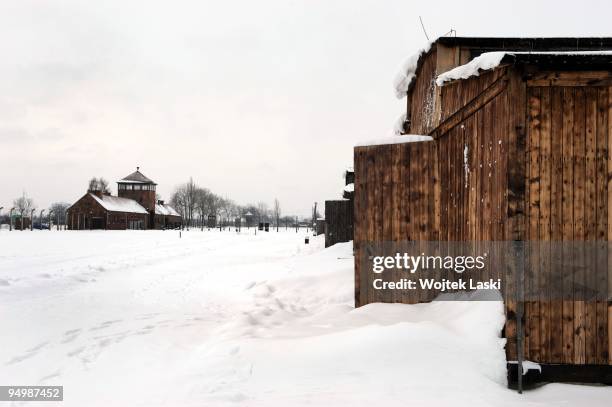 Barracks and the main entrance gate of Auschwitz II-Birkenau extermination camp on December 17, 2009 in Brzezinka, Poland. Auschwitz was a network of...