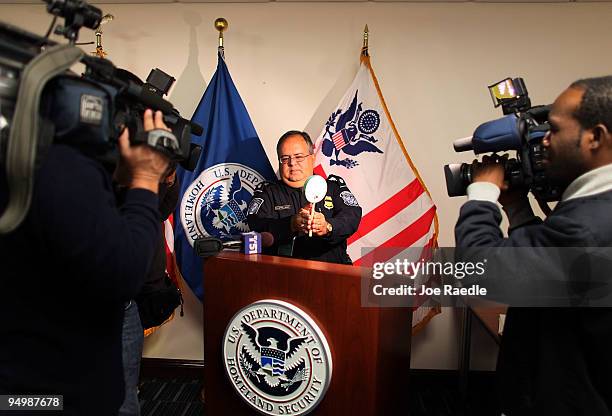 Jose L. Castellano from U.S. Customs and Border Protection shows off one of the toys intercepted by customs and determined to be dangerous by...