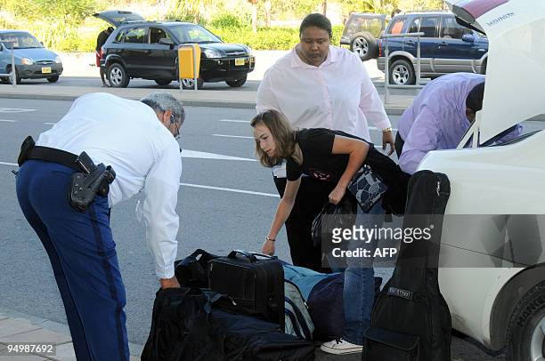 Year-old Dutch girl, Laura Dekker gets out of a car at the airport of Sint Maarten on December 21, 2009. Laura Dekker, who was barred by a court from...