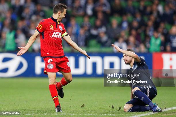 Isaas of Adelaide United gestures to James Troisi of the Victory after he falls over during the A-League Elimination Final match between Melbourne...