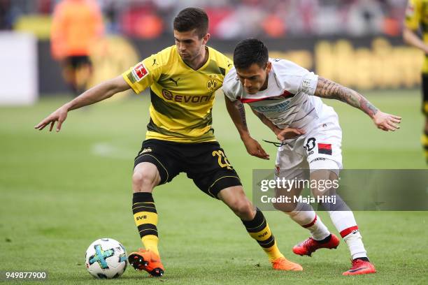 Christian Pulisic of Borussia Dortmund and Charles Aranguiz of Bayer Leverkusen battle for the ball during the Bundesliga match between Borussia...