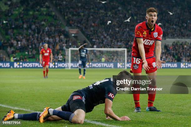 Nathan Kostandopoulous of Adelaide United pleads to the referee during the A-League Elimination Final match between Melbourne Victory and Adelaide...