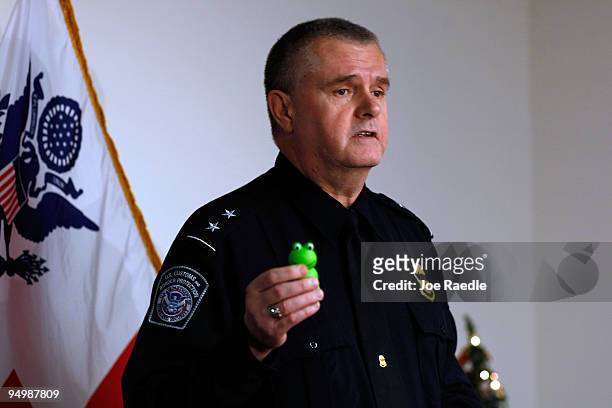 Harold Woodward, Director Field Operations for U.S. Customs and Border Protection, shows to the media a lighter intercepted by customs and determined...
