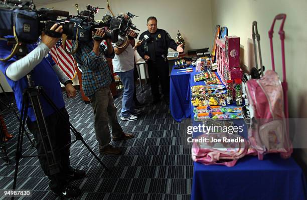 The media records as Jose L. Castellano from U.S. Customs and Border Protection shows off some of the toys intercepted by customs and determined to...