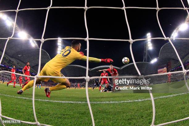 Paul Izzo of Adelaide United dives to save a goal during the A-League Elimination Final match between Melbourne Victory and Adelaide United at AAMI...