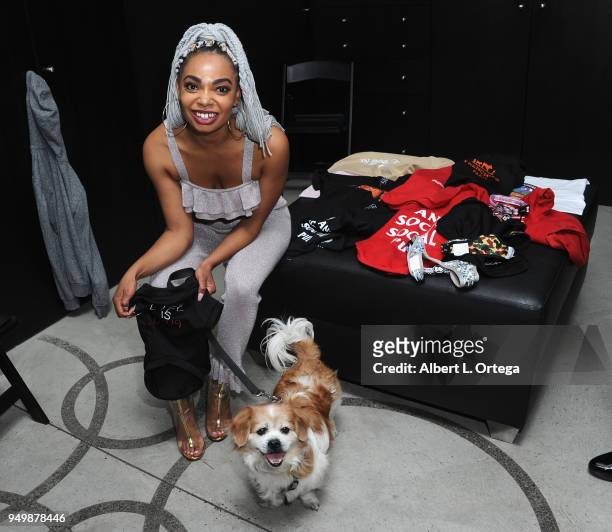 Tiara Monet poses with Mickey for Brand Bash Canine's And Cocktails To Benefit The Little Red Dog held at Sowden House on April 21, 2018 in Los...