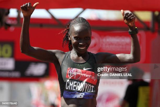 Kenya's Vivian Cheruiyot celebrates winning the elite women's race of the 2018 London Marathon in central London on April 22, 2018.