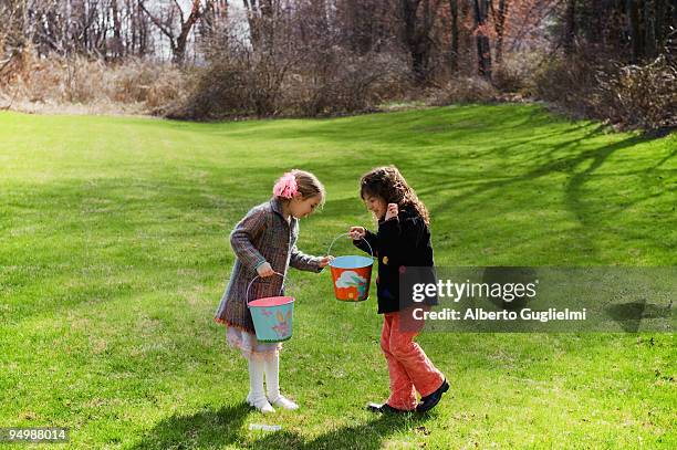 girl finding easter eggs - alberto guglielmi stock pictures, royalty-free photos & images