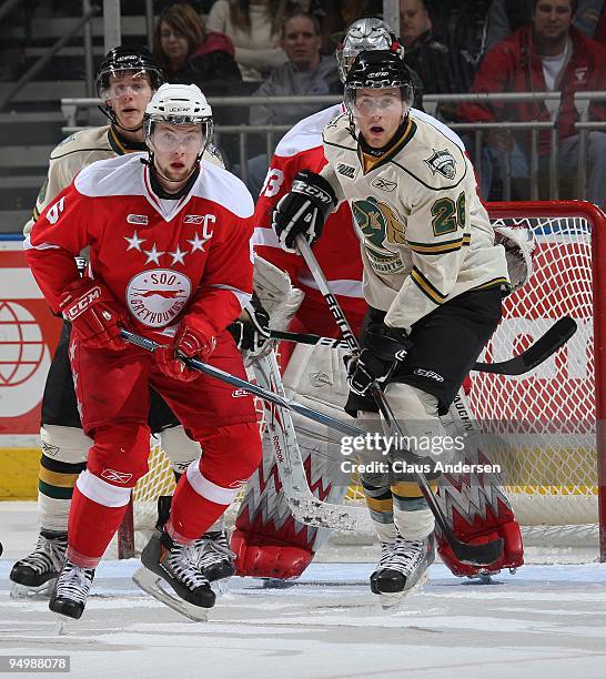 Jacob Muzzin of the Sault Ste. Marie Greyhounds defends next to Colin Martin of the London Knights in a game on December 18, 2009 at the John Labatt...