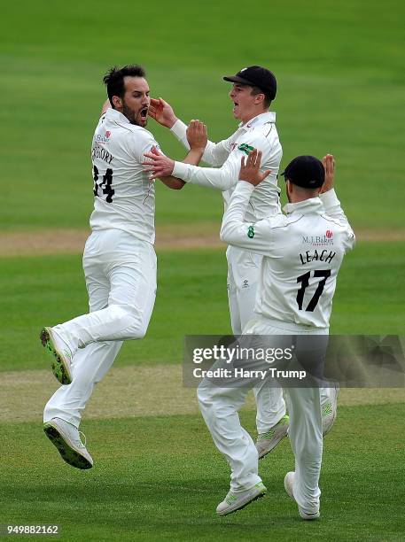Lewis Gregory of Somerset celebrates the wicket of Joe Clarke of Worcestershire with Tom Abell and Jack Leach of Somerset during Day Three of the...