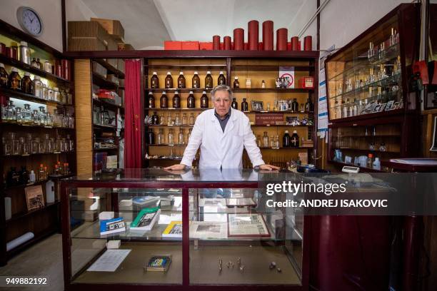 Nenan Jovanov poses for a picture in his 64 years old perfume shop in Belgrade on April 19, 2018. Nenad literally grow up in this "time capsule" shop...