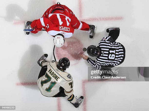 Vern Cooper of the Sault Ste. Marie Greyhounds gets set to take a faceoff against Phil Varone of the London Knights in a game on December 18, 2009 at...