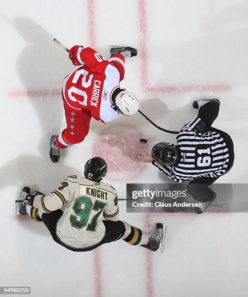 Jake Carrick of the Sault Ste. Marie Greyhounds takes a faceoff against Jared Knight of the London Knights in a game on December 18, 2009 at the John...