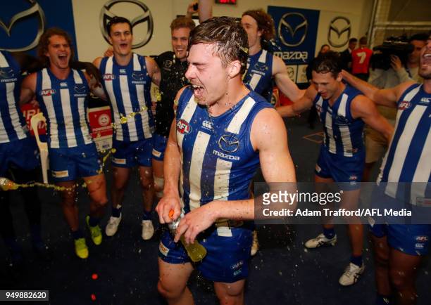 Cameron Zurhaar of the Kangaroos gets a gatorade shower after his first win during the 2018 AFL round five match between the North Melbourne...