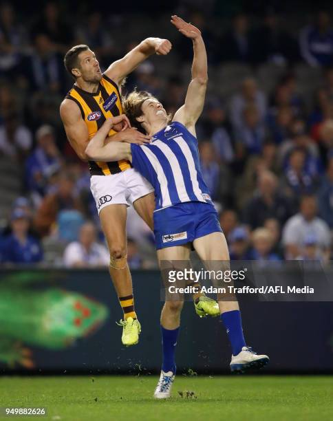 James Frawley of the Hawks and Ben Brown of the Kangaroos compete for the ball during the 2018 AFL round five match between the North Melbourne...