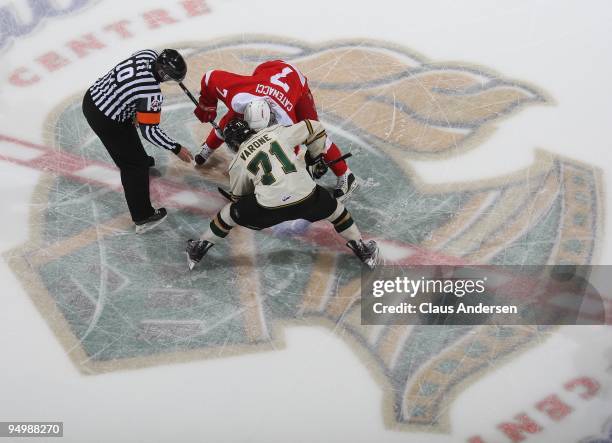 Daniel Catenacci of the Sault Ste. Marie Greyhounds takes a faceoff against Phil Varone of the London Knights in a game on December 18, 2009 at the...