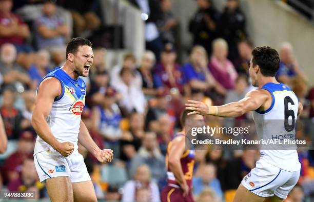 Steven May of the Suns celebrates after kicking a goal during the round five AFL match between the Brisbane Lions and the Gold Coast Suns at The...